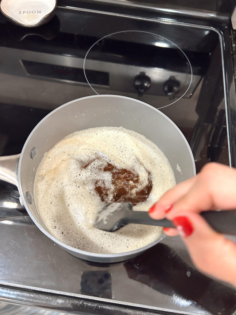 Woman stirring, browning butter on the stove