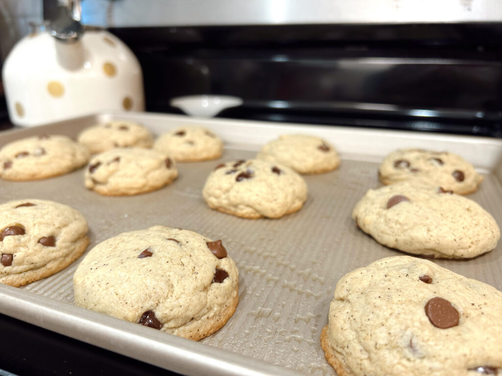 Browned butter sourdough chocolate chip cookies freshly baked on the baking sheet.